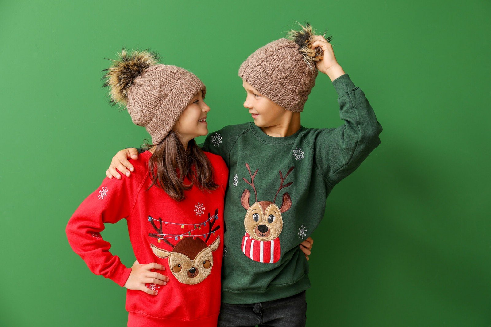 Little children in Christmas sweaters