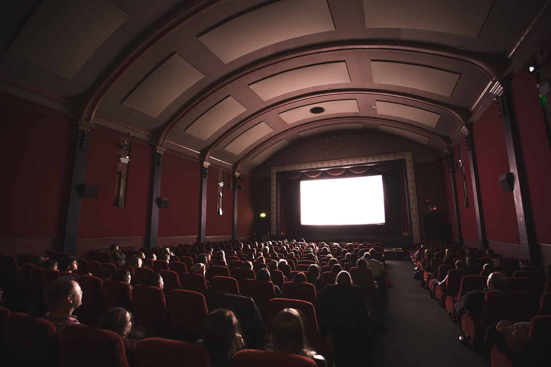 Audience watching movie in cinema
