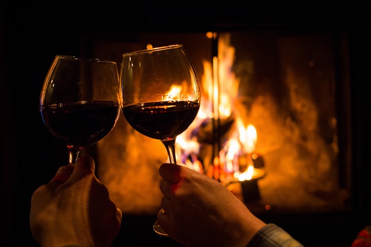 wine glasses by the fireplace